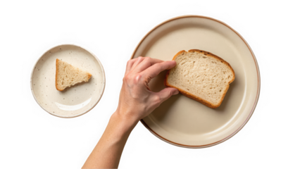 A hand reaching for a slice of bread on a plate, with a smaller plate holding a triangular piece of bread.