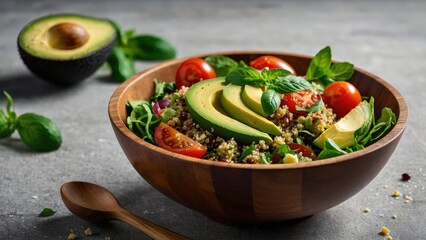Healthy quinoa salad with avocado and cherry tomatoes in a wooden bowl photograph