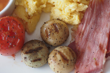 Delicious Breakfast Plate with Eggs, Bacon, and Grilled Vegetables