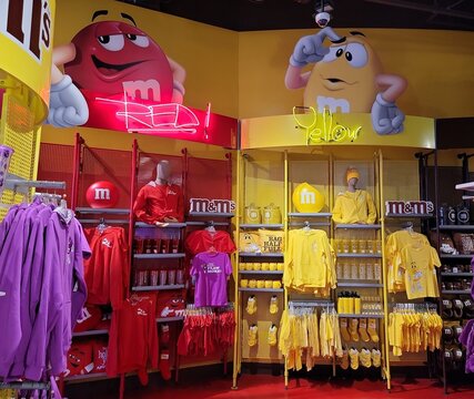 The M&M candy characters inside M&M flagship store, Times Square, New York, USA. M&Ms are color-varied sugar-coated drag&eacute;e chocolate candies with the letter "m" on it.  Photo by Artist Nadia Russ.