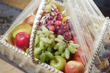 An Elegant Fruit Basket Filled with a Delightful Assortment of Fresh Fruits