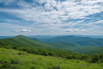 Fototapeta premium A time-lapse summer mountain landscape capturing the flow of clouds over green peaks and open horizons.
