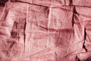 This image shows a wrinkled red fabric background for textures and patterns