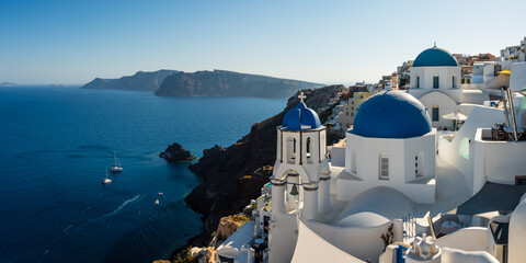 Panoramic of Oia town with iconic churches and mediterranean sea, Santorini, Greece