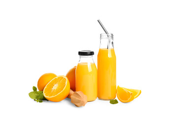 Glass and bottle of fresh orange juice with mint on white background