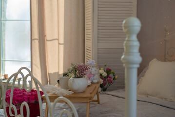 Beautiful floral interior with bed. High quality photo