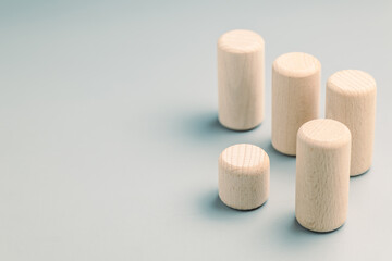 A small tube wooden toys in the longer group, conceptual image, business competition, niche market, positioning, or development