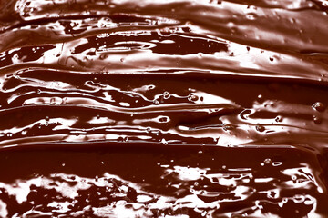 Closeup view of brown melted chocolate as background