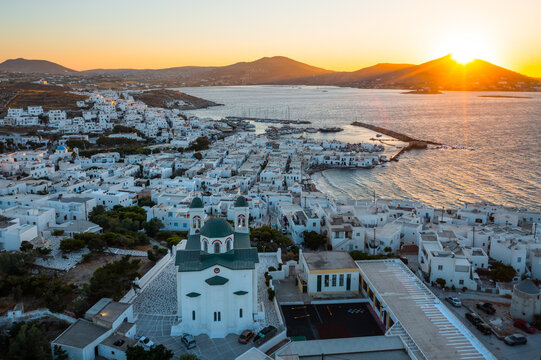 Aerial view of Naoussa old town and island at sunset, Paros, Greece