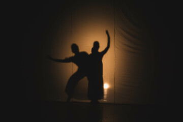 silhouette of a person with a guitar