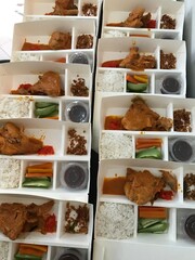 boxes of chicken red curry and rice