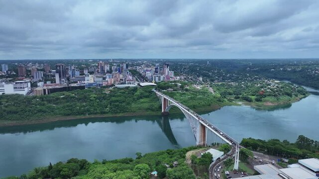 Drone view of the International Friendship Bridge highway 277 over the Parana River connecting Foz do Igua&ccedil;u Brazil to Ciudad del Este Paraguay in the background