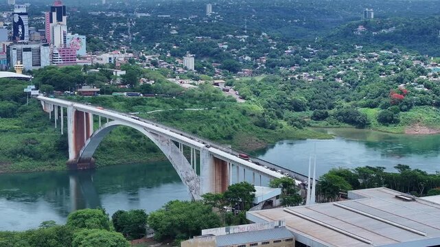 Drone view of the International Friendship Bridge highway 277 over the Parana River connecting Foz do Igua&ccedil;u Brazil to Ciudad del Este Paraguay in the background