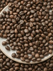 Fototapeta premium Close-up shot of a plate filled with freshly roasted coffee beans, aroma, aromatic, drink