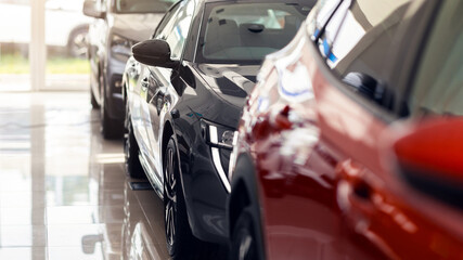 Closeup of brand new luxury automobiles exhibited in vip showroom, shiny newest cars different...