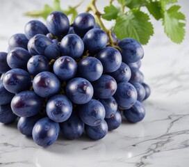 Close-up of blue juicy grapes bunch on a white marble surface with subtle shine and reflections, blue grapes, close up, food, fruit close up