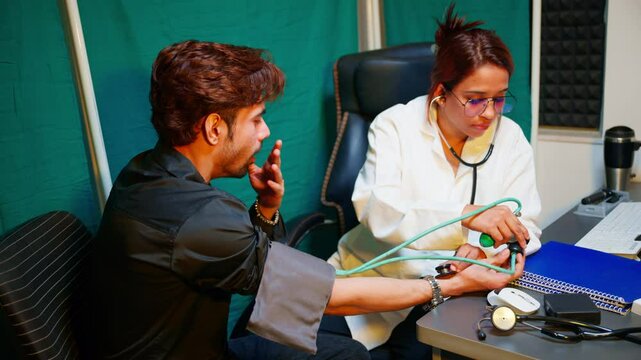 Surgeon wraps a cuff around unwell mans arm