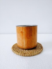 handicrafts from leftover wood in the form of glasses and cups. Aesthetic wooden glasses are suitable for cafes, restaurants and homes. on a white background