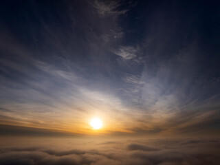 Drone photograph of sun above the clouds in high altitude photo