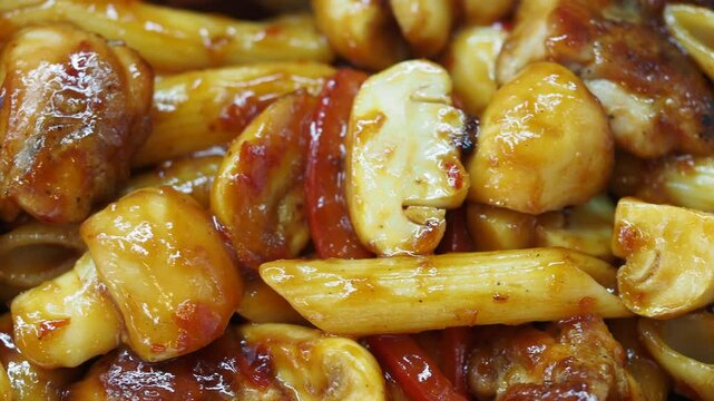 Penna pasta with chicken, mushrooms, and peppers