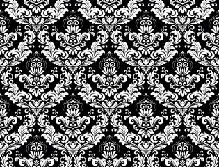 Wallpaper in the style of Baroque. Seamless vector background. White and black floral ornament. Graphic pattern for fabric, wallpaper, packaging. Ornate Damask flower ornament.