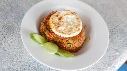 A food called fried rice with cucumber and eggs typical of Asia with a traditional recipe