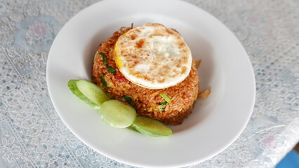 A dish called fried rice typical of Asia with vegetables as decoration and delicious seasoning