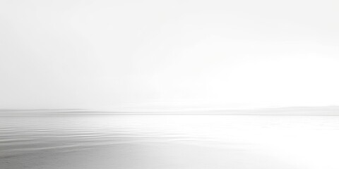 Large body of water with a white sky in the background
