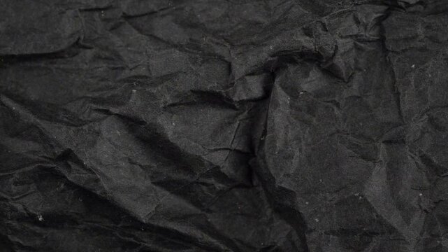 Seamless looped stop motion black and white color grungy and noisy texture. Grunge surface cardboard. Crumbled paper texture.