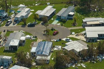 Destroyed by hurricane Ian suburban houses in Florida mobile home residential area. Consequences of...