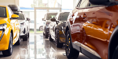 Closeup of brand new luxury cars exhibited in vip showroom, shiny newest automobiles different...
