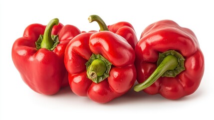 Three vibrant red bell peppers glistening with moisture, captured in a close-up studio shot against a pure white background. The i