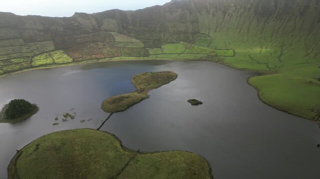 Azores, amazing Corvo island, in the middle of the Atlantic Ocean, green Corvo crater with the beautiful lake of Lagoa do Cachimbo.