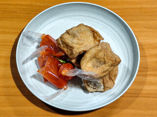 Tahu pentol served with tomato sauce, a traditional Indonesian food.