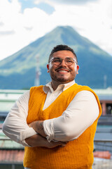 Fototapeta premium Photograph of happy gay man with a volcano in the background
