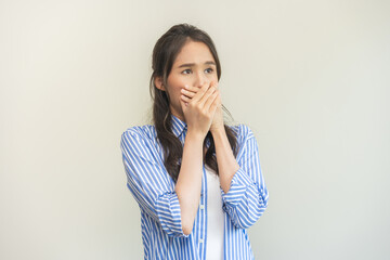 Portrait of pretty brunette hair, disgust smell bad breath strong asian young woman shocked...