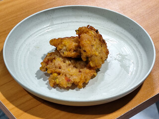 Corn omelet or corn omelet. A traditional Indonesian side dish made from corn and flour. Also called corn fritters.
