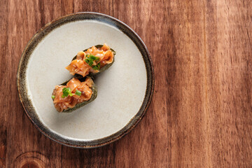Chopped jellyfish Gunkan Maki on a Round Plate