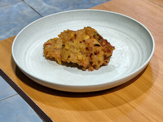 Corn omelet or corn omelet. A traditional Indonesian side dish made from corn and flour. Also called corn fritters.