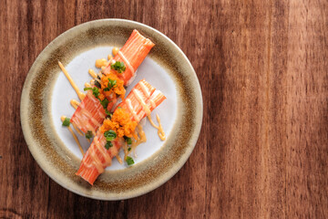 Crab Stick Sashimi with mayonnaise Sauce and Fish Roe Served on a Plate