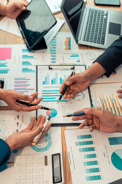 Group of Asian businessmen brainstorming on team cooperation Happy team meeting meeting room, business and financial data graphs vertical close-up image
