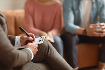 Help Concept. Closeup Cropped View Of Consultant Writing Taking Notes, Selective Focus On Hand With...