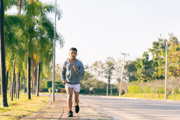 Fototapeta premium Black African American man running on the street, morning exercise, health concept.