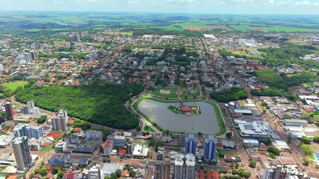 Panoramic view of Toledo city and its beautiful Municipal Lake, surrounded by agricultural zones in the countryside of Brazil.
