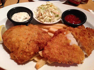 fish and chip with Coleslaw and tomato ketchup