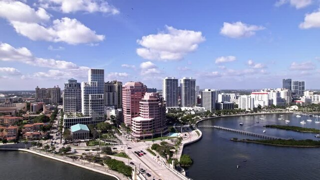 Establishing drone shot of One Flagler, Phillips Point Building and West Palm Beach cityscape in Florida, USA