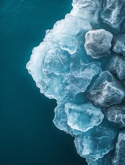 Obraz premium Iceberg melting in teal ocean.