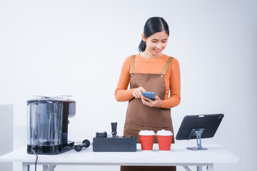 Asian female barista with a beautiful smile, skillfully making coffee in a cozy small shop, creating a warm and welcoming atmosphere for customers in the charming cafe