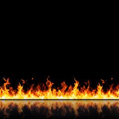 Flames erupting in a dark environment abstract imagery fire elements black background dynamic viewpoint