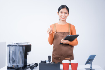 Asian female barista with a beautiful smile, skillfully making coffee in a cozy small shop, creating a warm and welcoming atmosphere for customers in the charming cafe